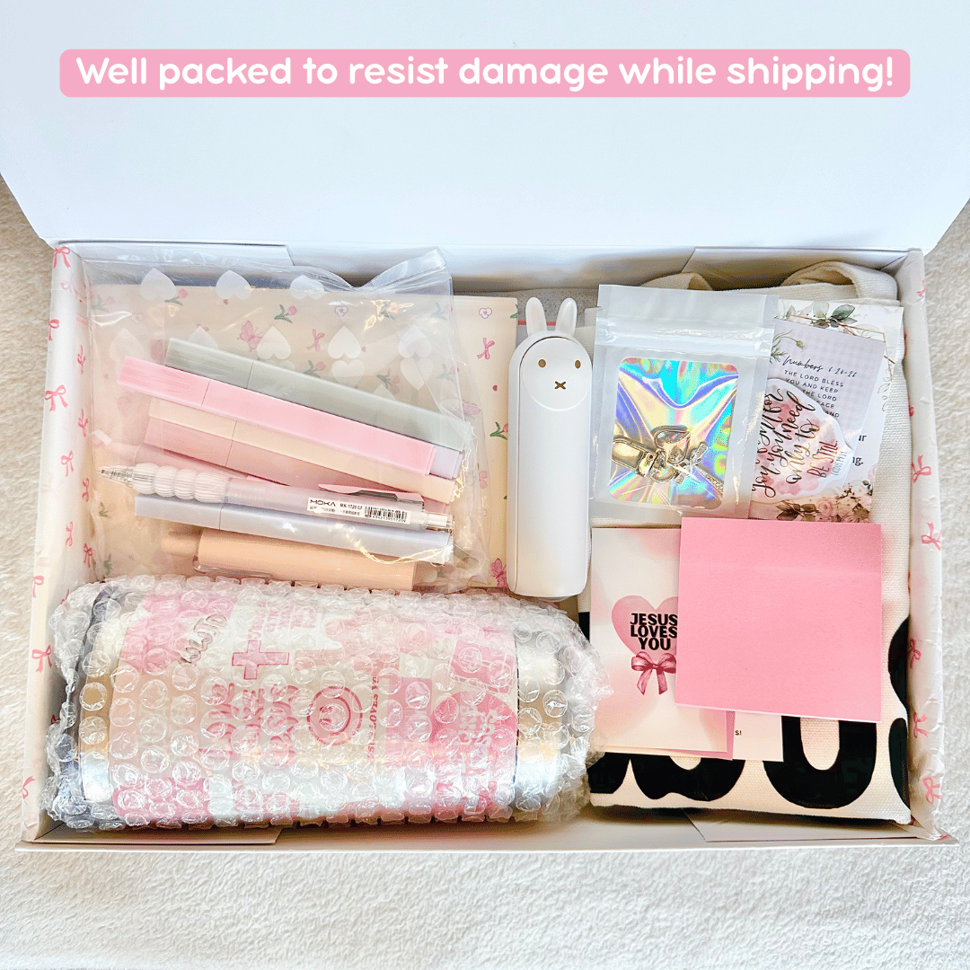 A box filled with christian gifts and bible study supplies that is well packed to resist damage while shipping