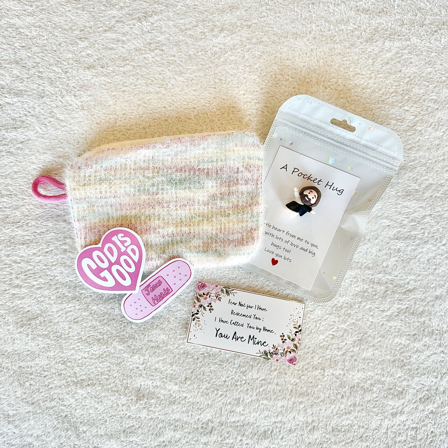 Christian gift box featuring mini Jesus statue and compact makeup bag